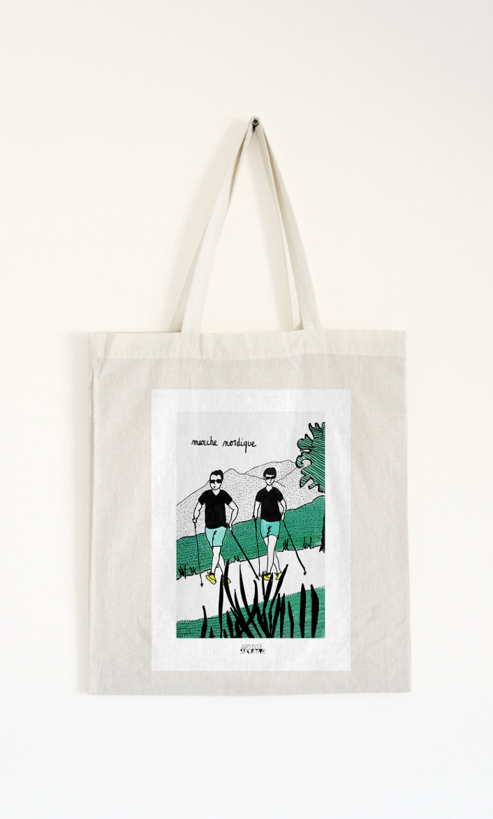 a tote bag with a picture of two people on a bike