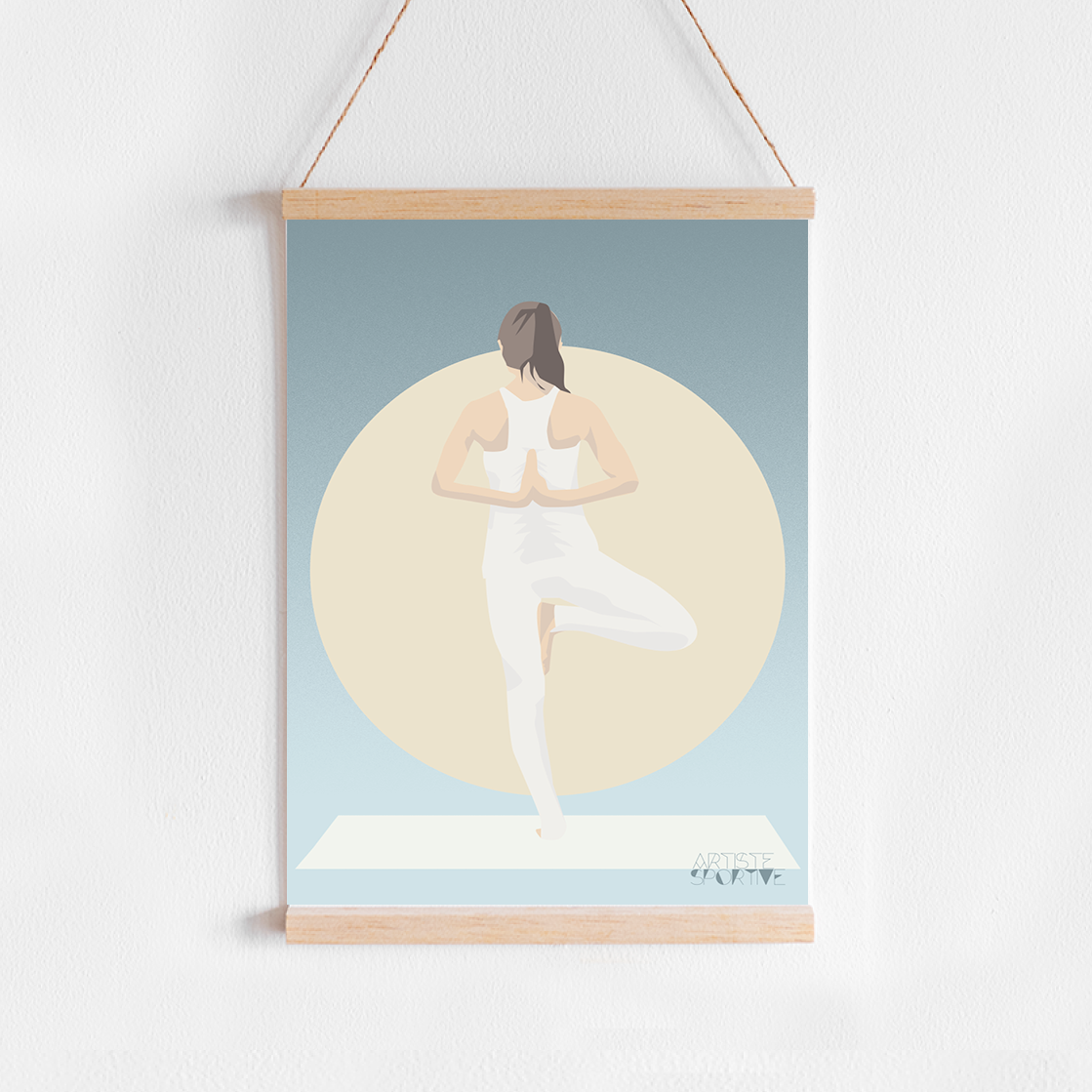 a picture hanging on a wall of a woman doing yoga