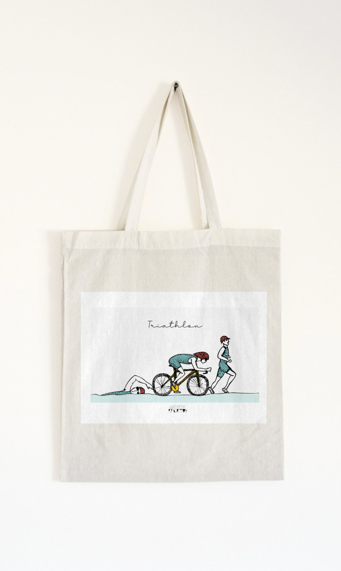 a tote bag with a picture of a person riding a bike