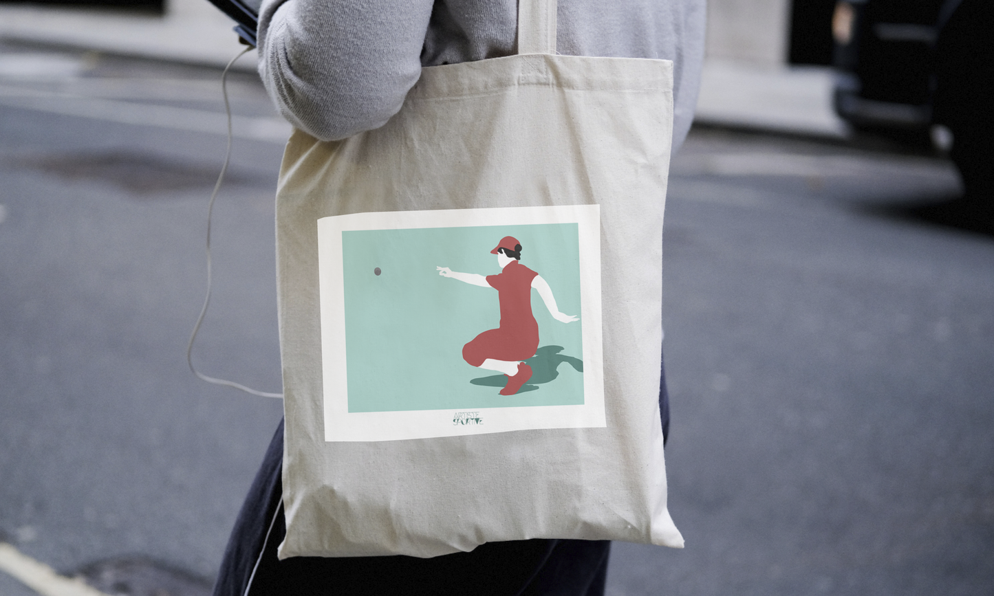 a person carrying a bag with a picture of a woman on it