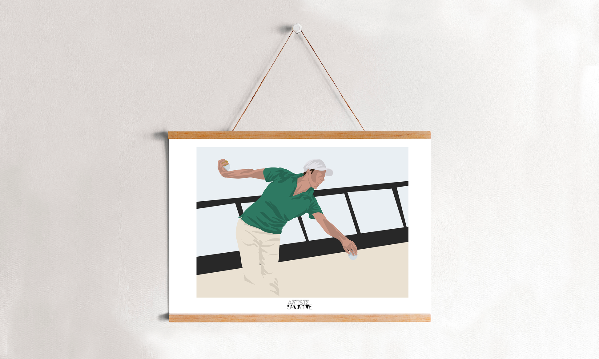 a picture of a man playing tennis hangs on a wall