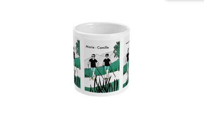 a coffee mug with a picture of two people on it