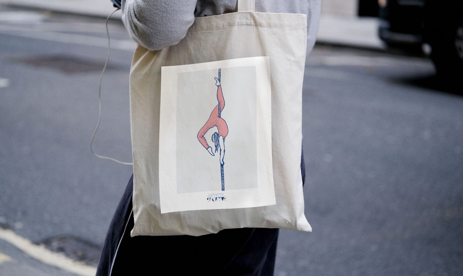 a person holding a bag with a drawing on it