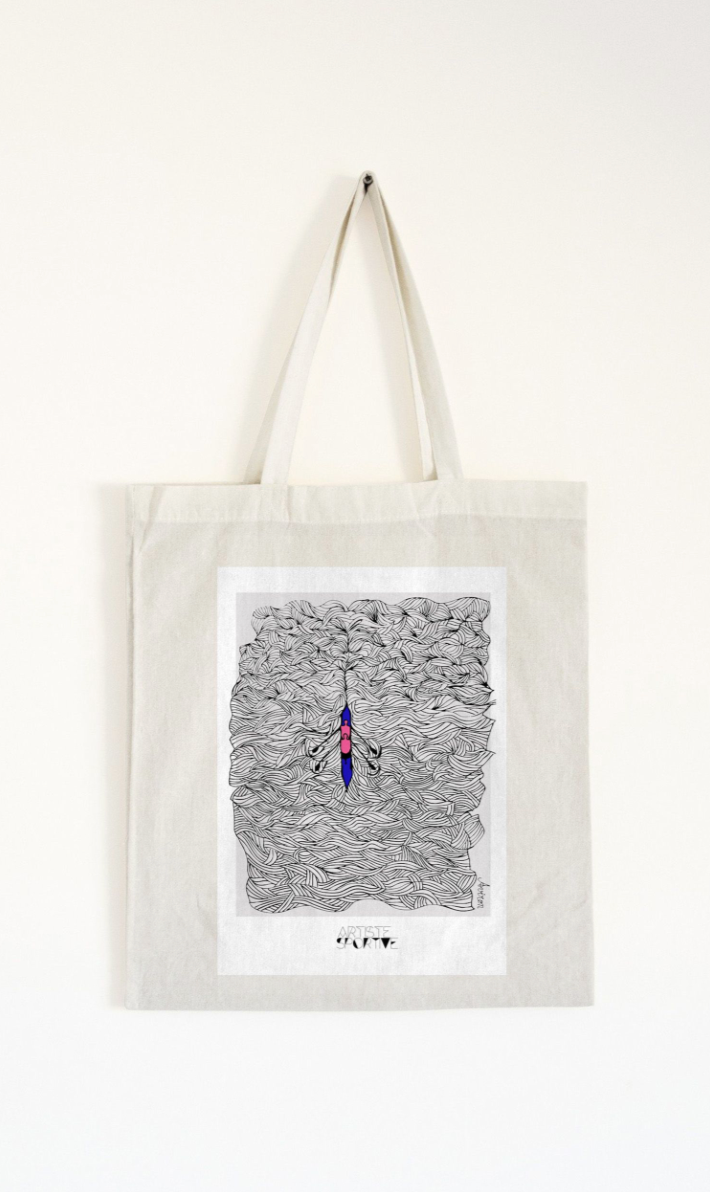 a tote bag hanging on a wall