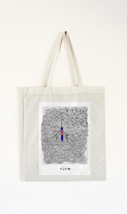a tote bag hanging on a wall