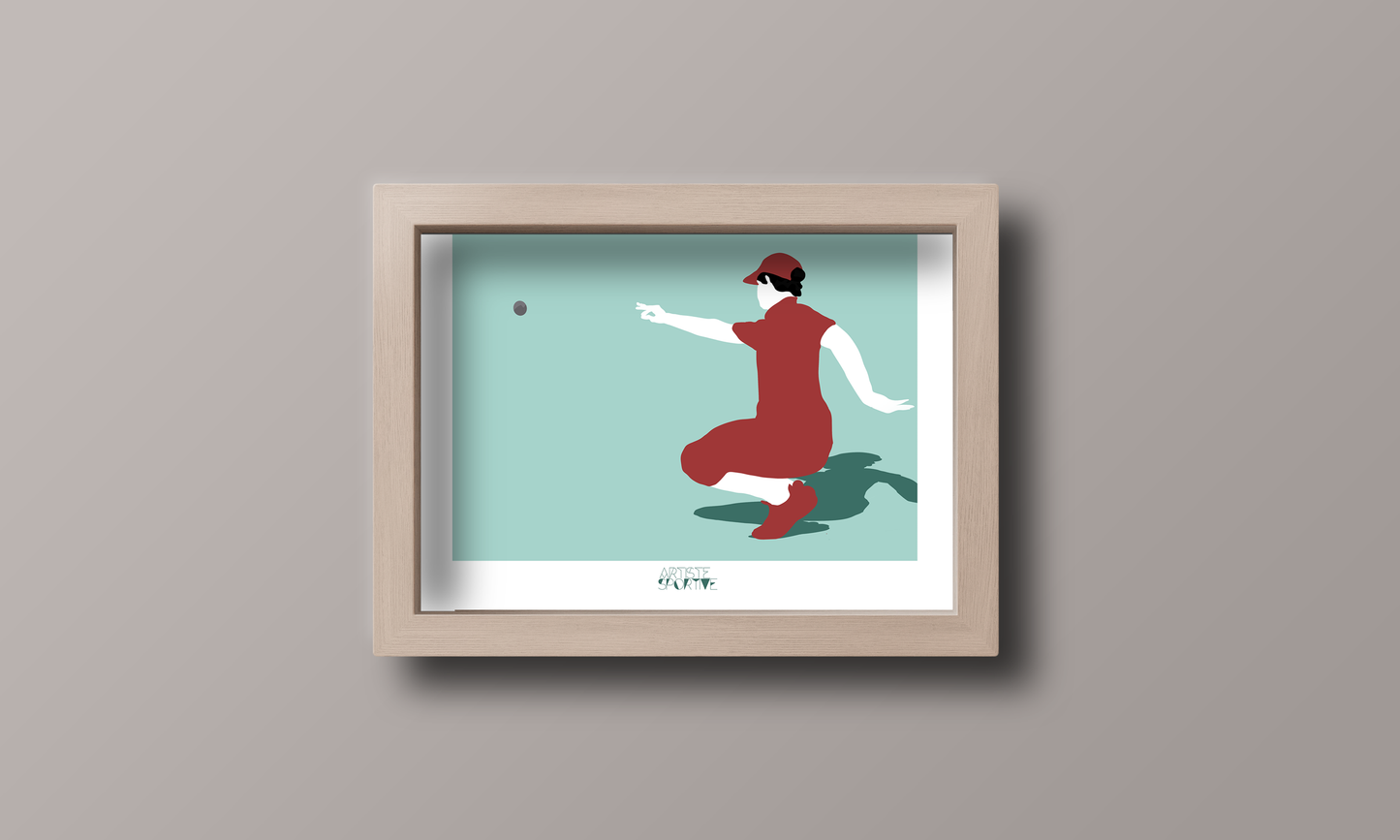 a framed picture of a woman throwing a ball