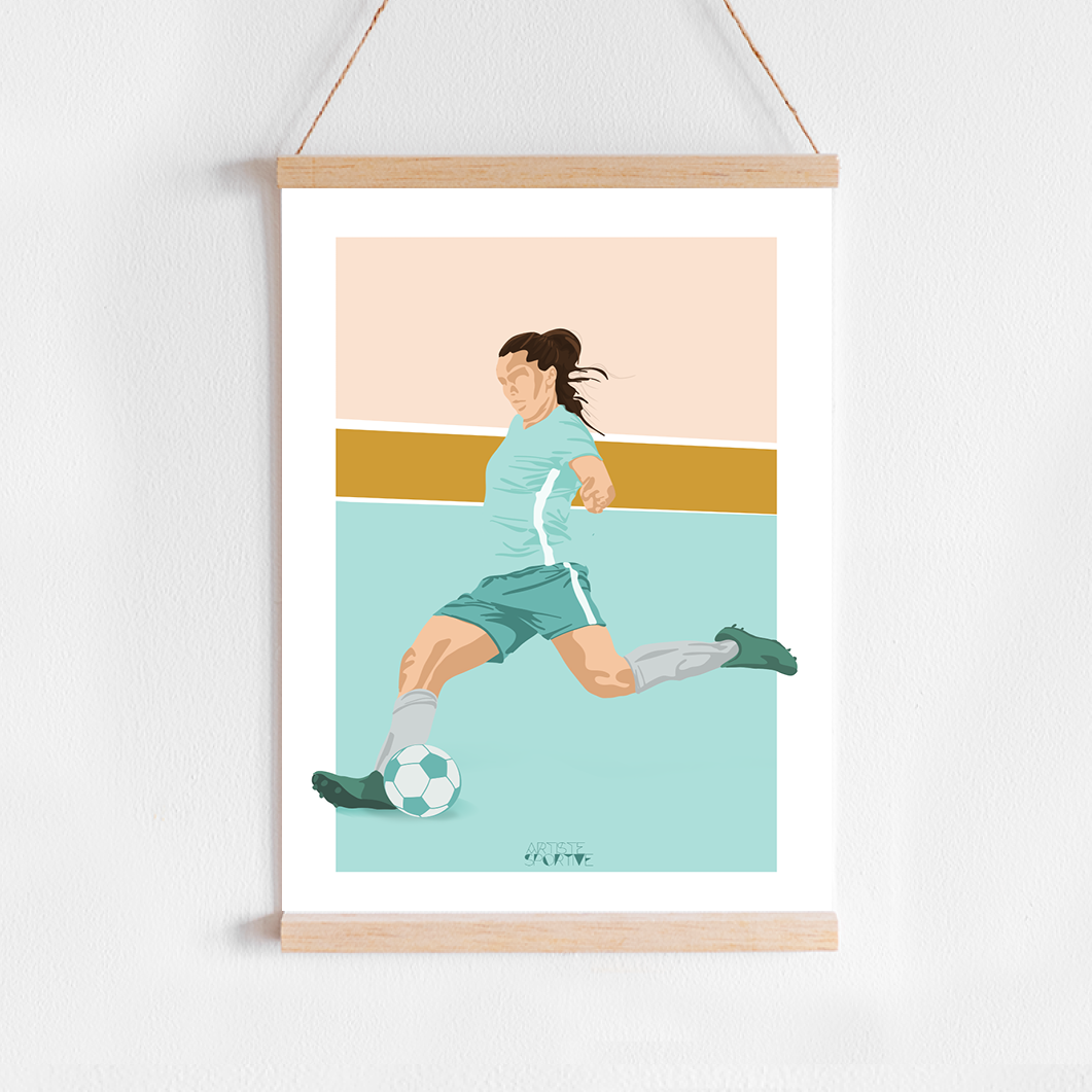 a picture hanging on a wall of a woman playing soccer