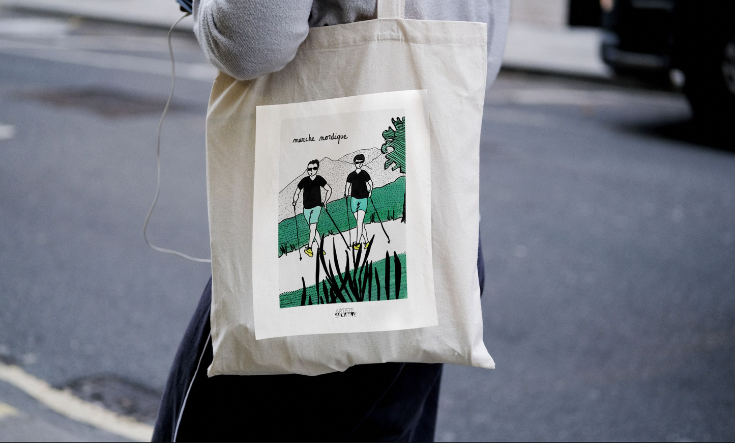 a person holding a bag with a picture on it