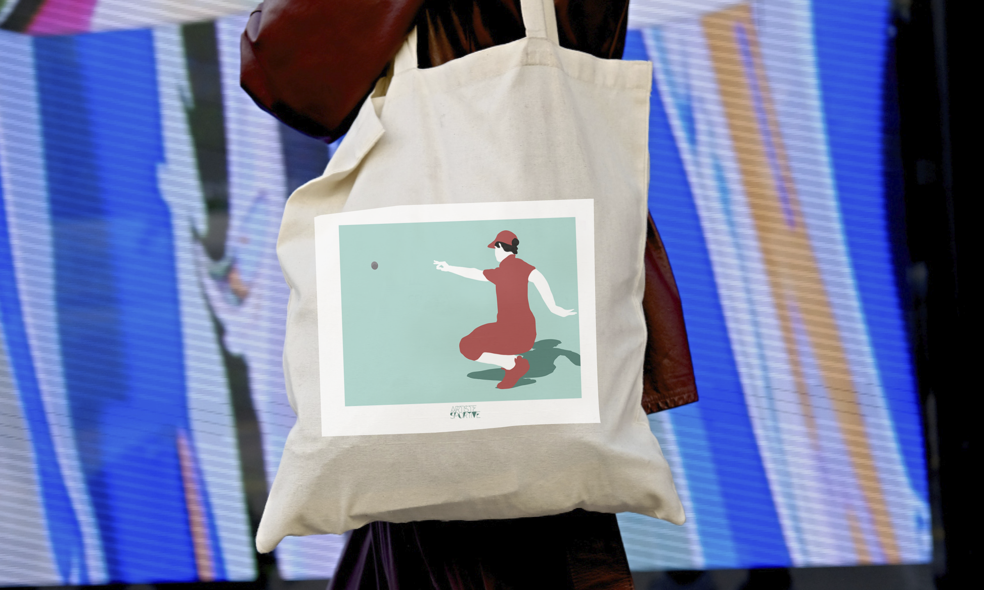 a woman carrying a tote bag with a picture of a woman on it