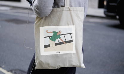 a person holding a bag with a picture of a woman on it