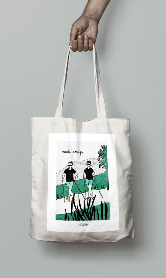 a person holding a bag with a picture of two people on it