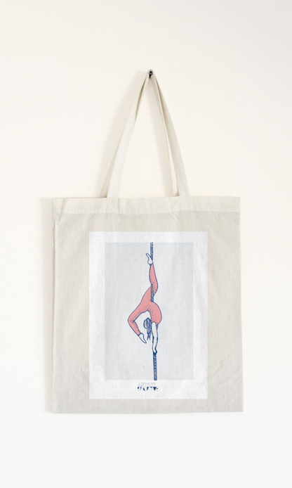 a tote bag hanging on a wall