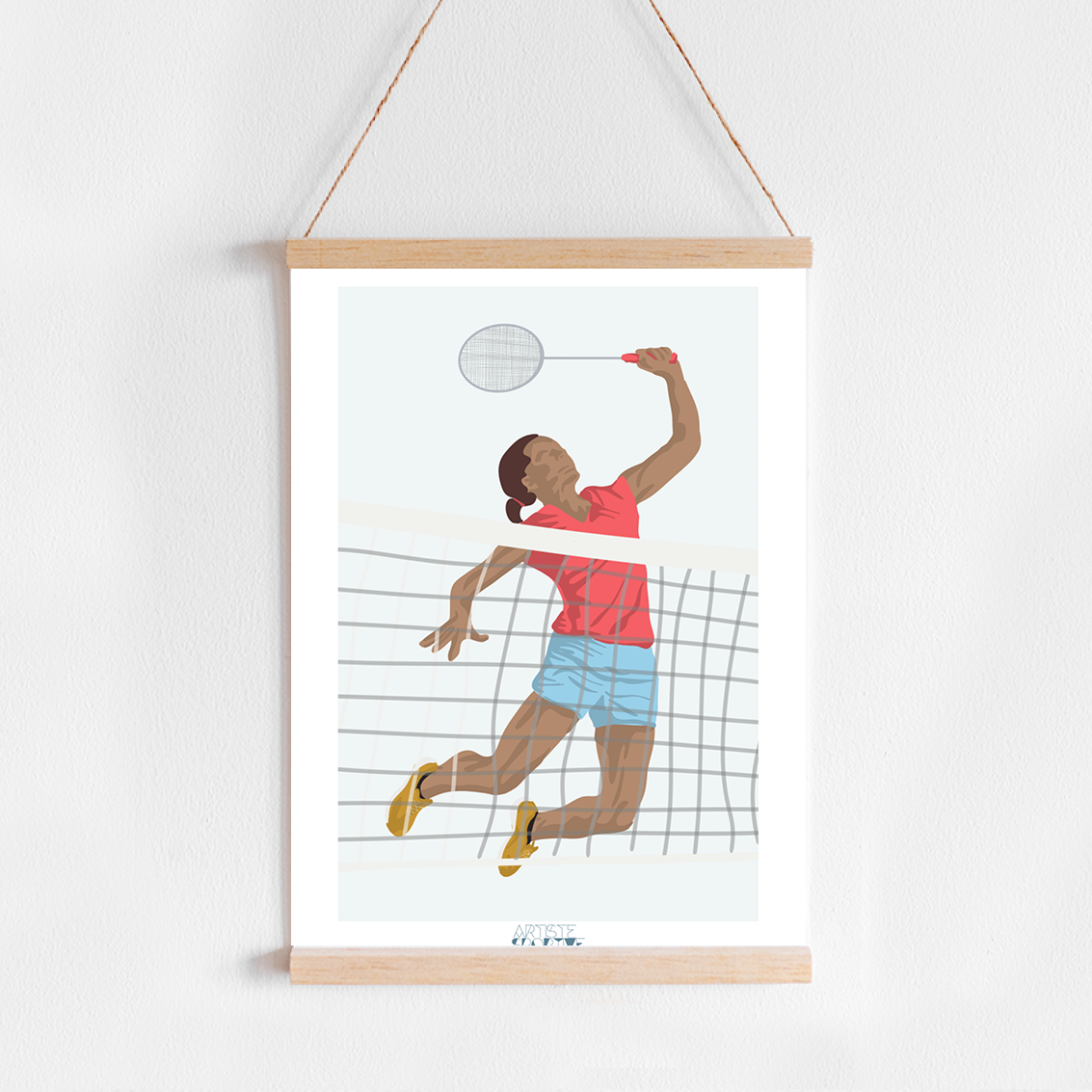 a picture of a man playing tennis hangs on a wall