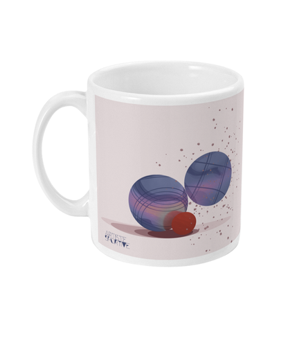 a coffee mug with two balls on it