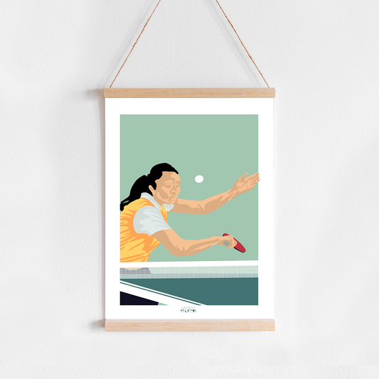 a picture of a woman playing tennis hangs on a wall