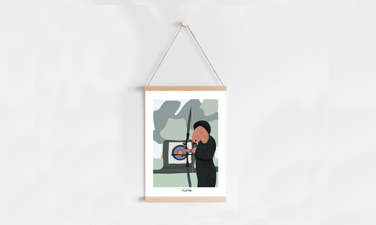 a picture hanging on a wall with a string