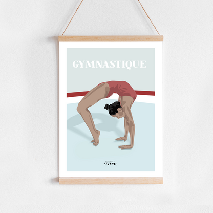 a poster hanging on a wall with a woman doing a handstand