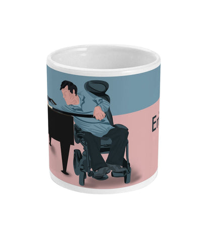 a coffee mug with a picture of a man playing a piano