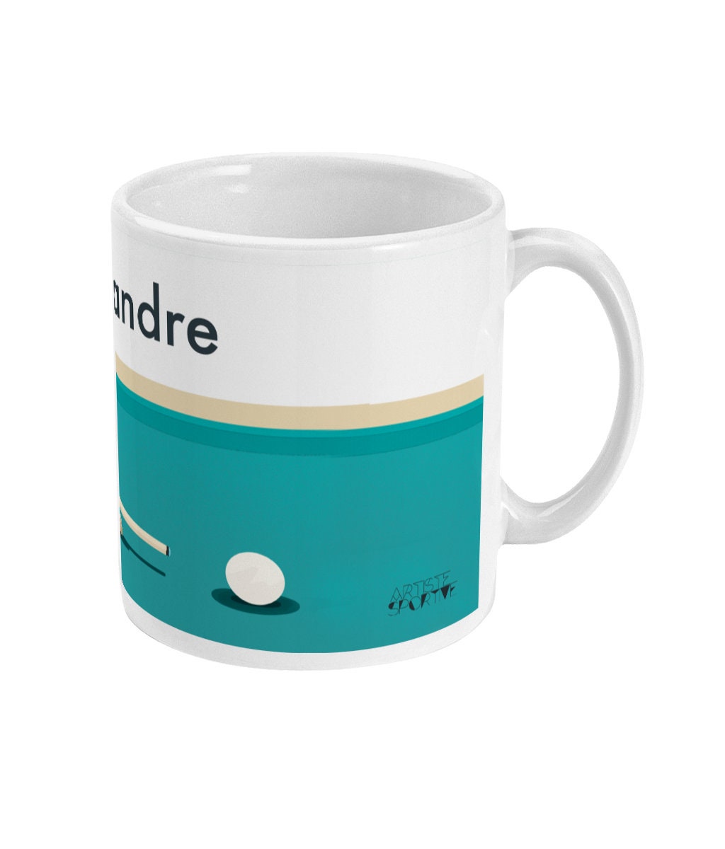 a coffee mug with a picture of a golf ball on it