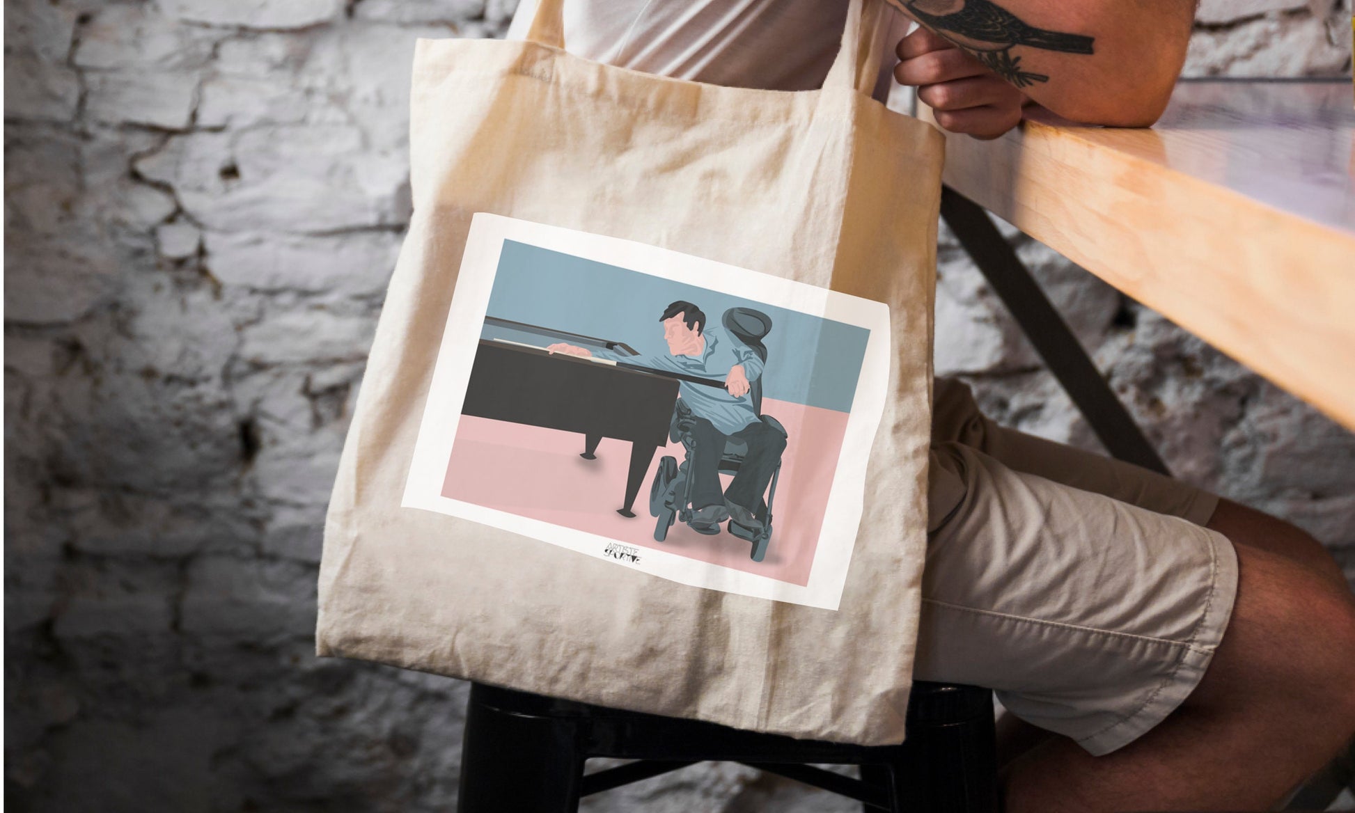 a person sitting at a table with a tote bag