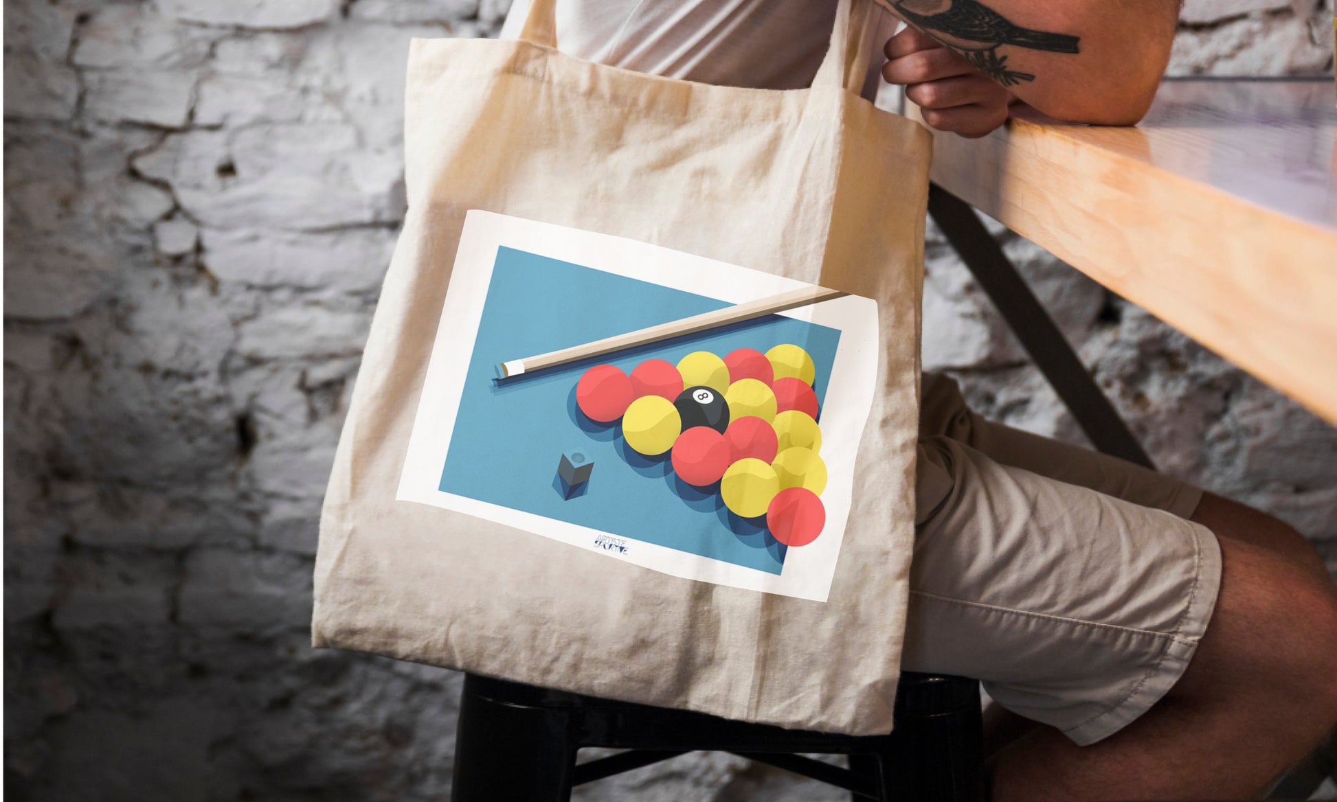 a person sitting at a table with a bag