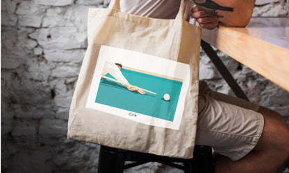 a person sitting at a table with a bag