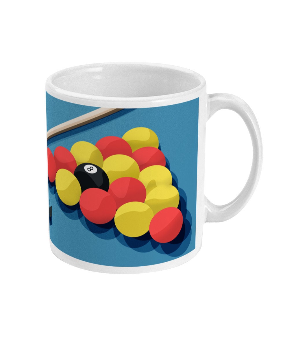 a coffee mug with a pool ball game on it