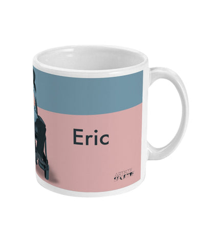 a coffee mug with a picture of a man on a chair