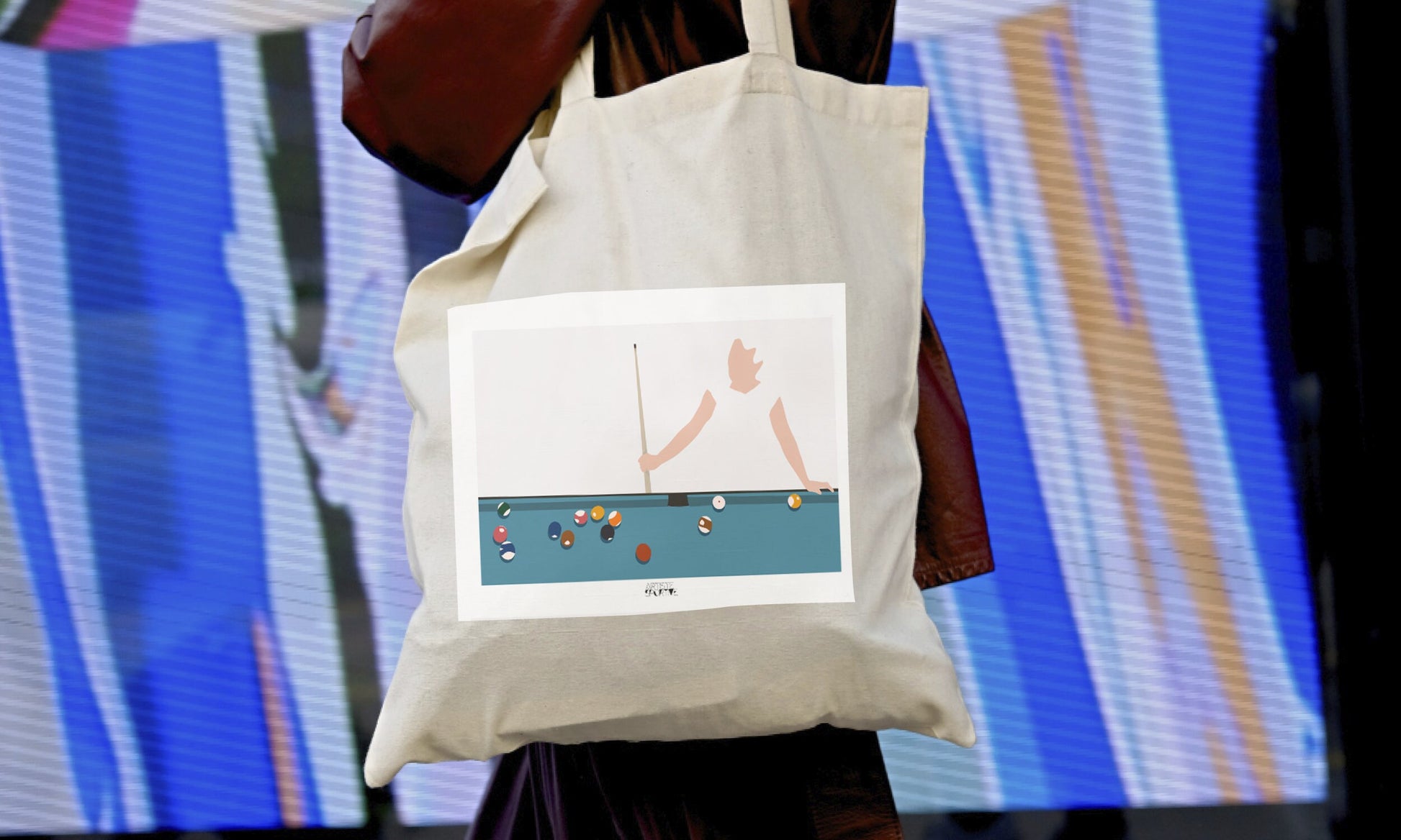 a woman carrying a bag with a picture of a woman on it