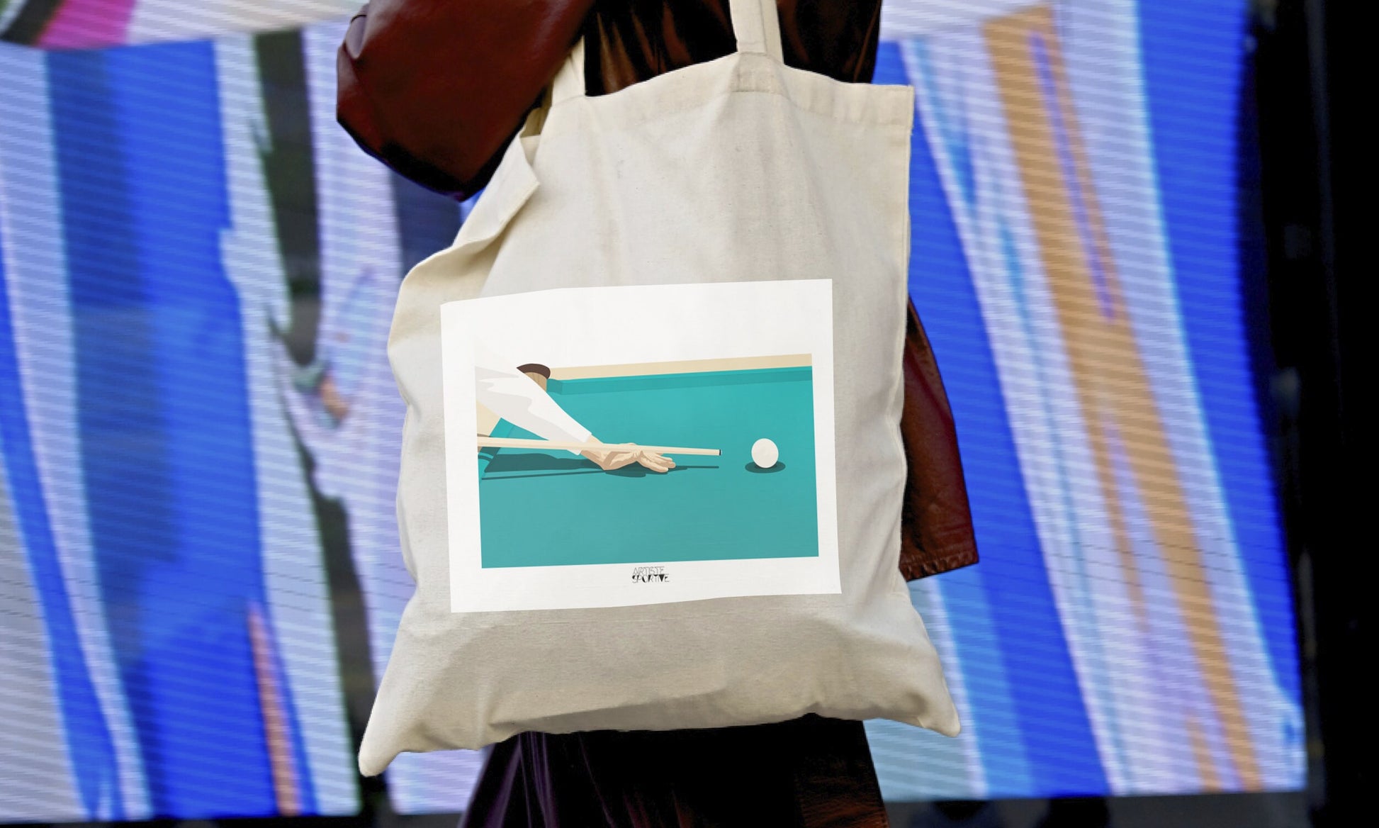 a person holding a bag with a picture of a person on it