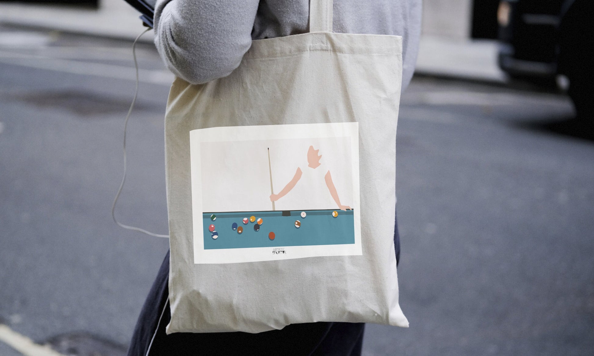 a person holding a bag with a picture on it