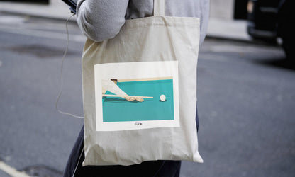 a person holding a bag with a picture of a person on it